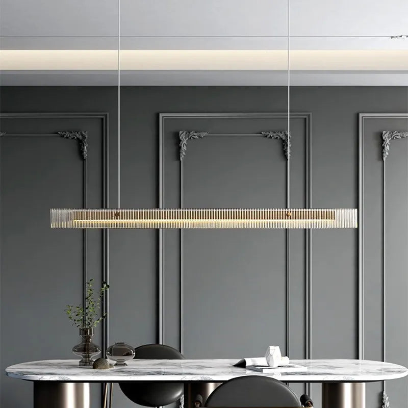 https://cdn.shopify.com/s/files/1/2499/8120/files/light-luxury-stainless-steel-crystal-chandelier-minimalist-long-strip-restaurant-pendant-lamp-cafe-bar-dining-table-led-fixtures-6.png?v=1705435656