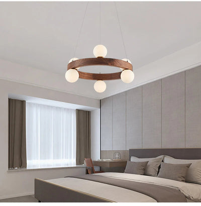 https://cdn.shopify.com/s/files/1/2499/8120/files/iwp-nordic-round-wooden-ring-chandeliers-parlor-log-hanging-lamp-dining-room-kitchen-bedroom-walnut-pendant-lights-with-g9-bulbs-3.jpg?v=1705090057