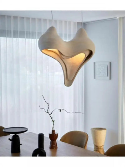 https://cdn.shopify.com/s/files/1/2499/8120/files/lustre-en-conque-design-nordique-wabi-sabi-pour-d-coration-int-rieure-2.jpg?v=1728032231