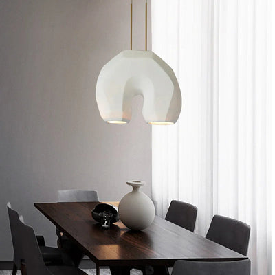 https://cdn.shopify.com/s/files/1/2499/8120/files/lustre-moderne-en-forme-de-u-design-en-r-sine-pour-clairage-d-tude-3.jpg?v=1718555369