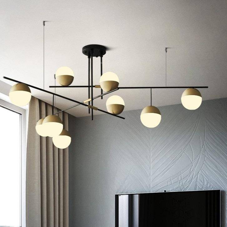 https://cdn.shopify.com/s/files/1/2499/8120/products/Lustredesignavecbranchesetboulesenverreetmetaldore_11fdf3b6-a7c9-4062-b608-873624ec6a5f.jpg?v=1632840363