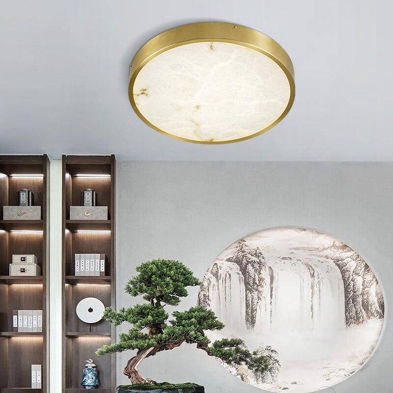 https://cdn.shopify.com/s/files/1/2499/8120/products/plafonnier-design-led-rond-en-marbre-avec-bords-dores_5b15ec99-35c5-410b-a441-8bb66c26ff14.jpg?v=1632851021