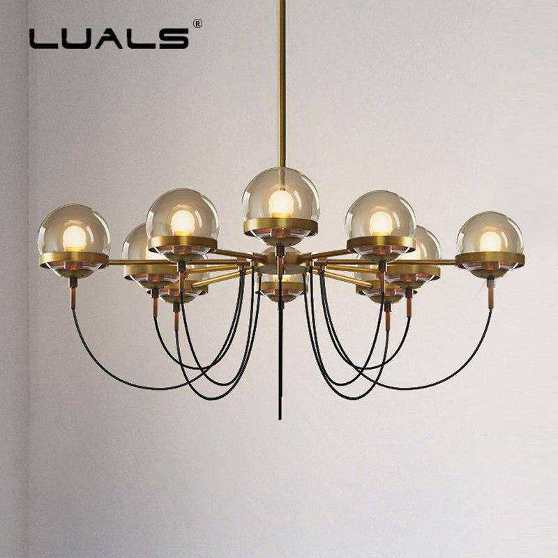 https://cdn.shopify.com/s/files/1/2499/8120/products/lustre-design-industriel-dore-avec-boule-en-verre_5a3771fc-0240-4ca1-b661-e3f5f46d0dc9.png?v=1632788875