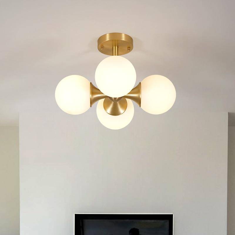 https://cdn.shopify.com/s/files/1/2499/8120/products/plafonnier-led-design-dore-avec-boules-en-verre_c81d5c34-e787-448e-9a7c-7867d00bc4fd.jpg?v=1632831439