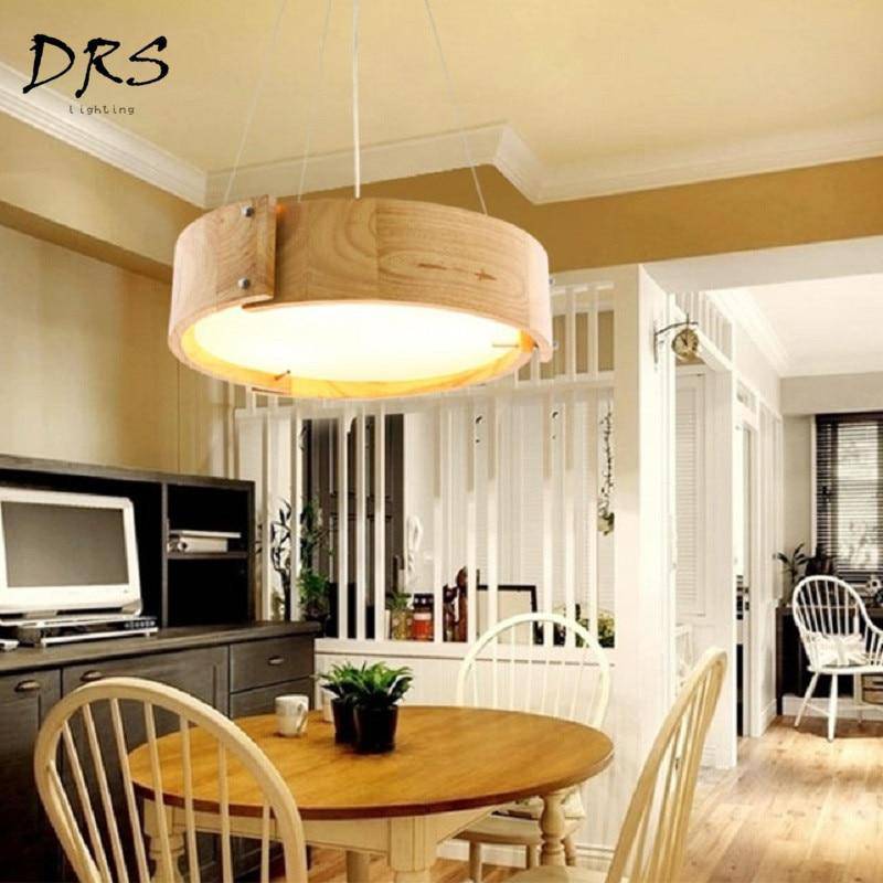 https://cdn.shopify.com/s/files/1/2499/8120/products/lustre-design-en-bois-arc-de-cercles_4e051a1d-547e-46cc-8727-53da45a9b484.jpg?v=1632829336